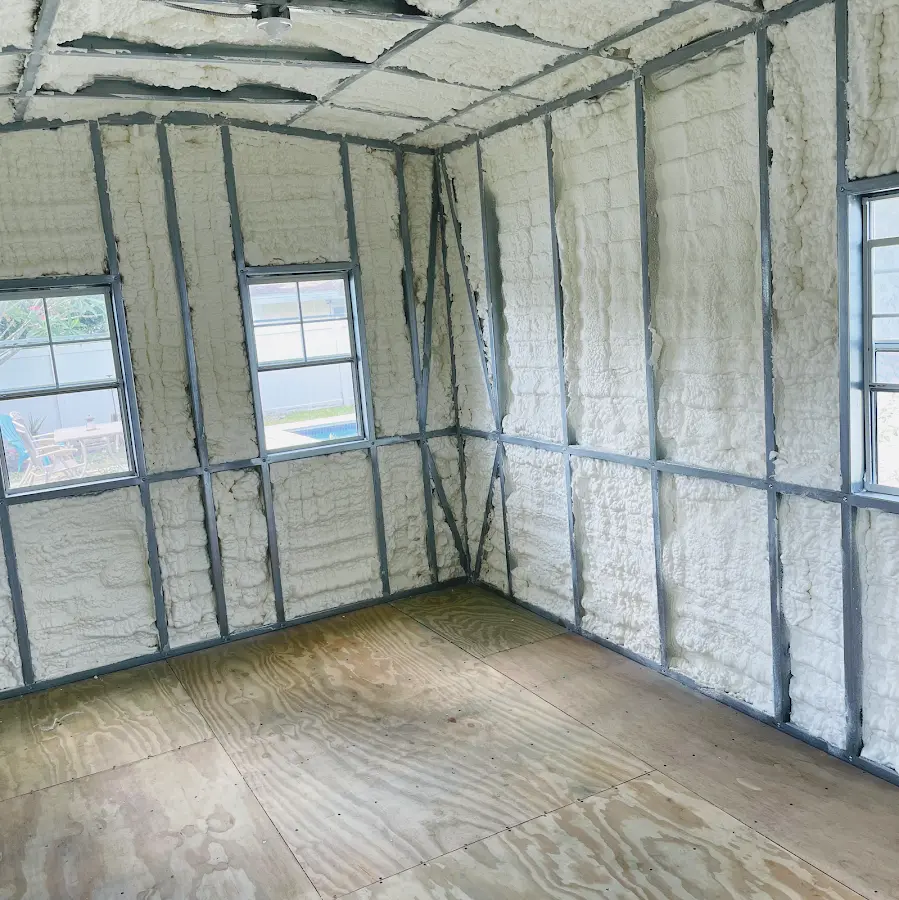 Closed-cell spray foam insulation applied to wall cavities in a residential project in Cedar Hill